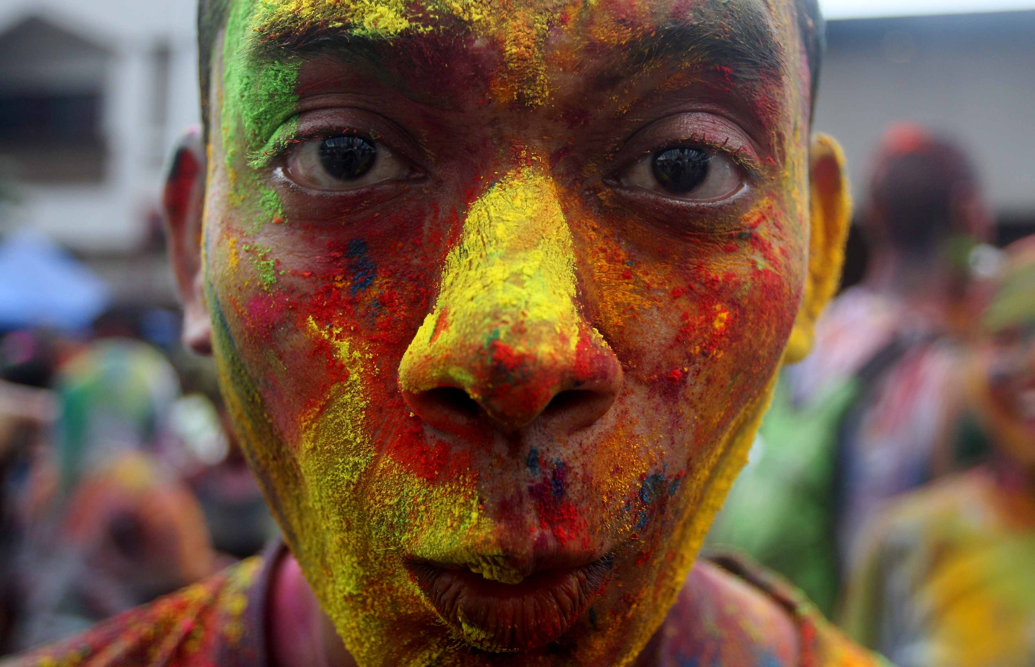 A boy face smeared with coloured powder during Holi festival celebrations at Shree Lakshmi Narayan Temple in Kuala Lumpur on March 31,2013 - a-boy-face-smeared-with-coloured-powder-during-holi-festival-celebrations-at-a-shree-lakshmi-narayan-temple-in-kuala-lumpur-on-march-312013