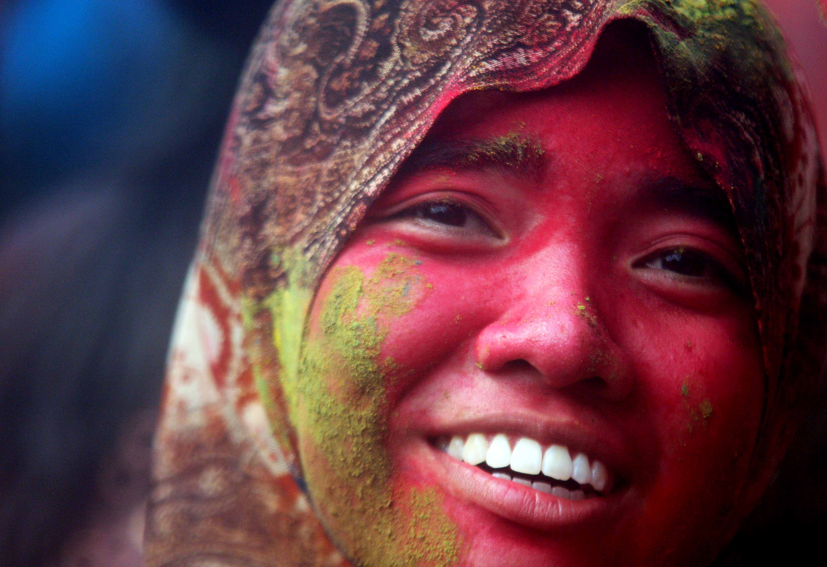 A malay girl, face with coloured powder during Holi festival celebrations at Shree Lakshmi Narayan Temple in Kuala Lumpur on March 31,2013 - a-malay-girl-face-with-coloured-powder-during-holi-festival-celebrations-at-a-shree-lakshmi-narayan-temple-in-kuala-lumpur-on-march-312013